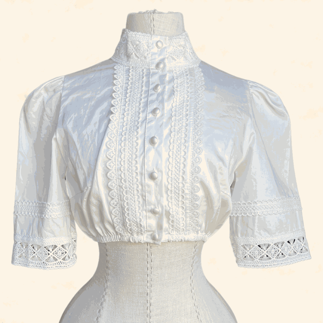 Ecru dirndl blouse from Kruger Collection made of 100% polyester, size 34.