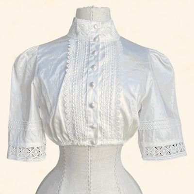 Ecru dirndl blouse from Kruger Collection made of 100% polyester, size 34.