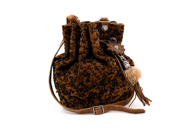 Pompadour in brown with floral element and fur tassel