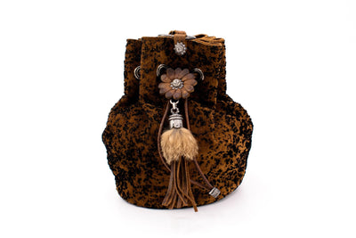 Pompadour in brown with floral element and fur tassel
