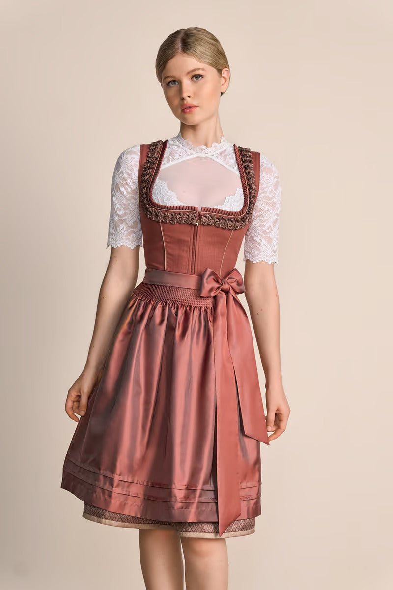 Kruger Midi Dirndl "Marielle" in red with sweetheart neckline and decorative trim, worn by a model, 60cm skirt length.