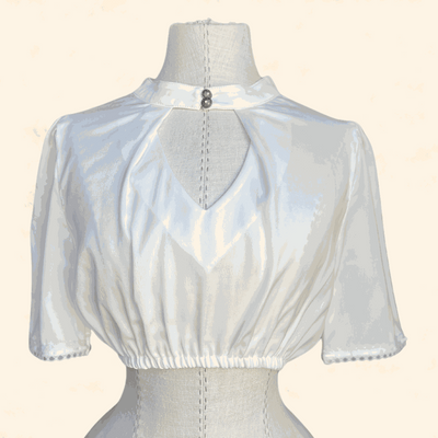 Ecru dirndl blouse from Kruger Collection, size 34, polyester.
