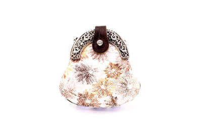 Brown clip bag with floral pattern and ornamental handle