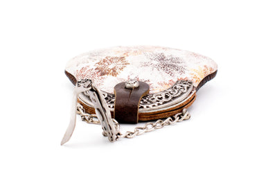 Brown clip bag with floral pattern and ornamental handle