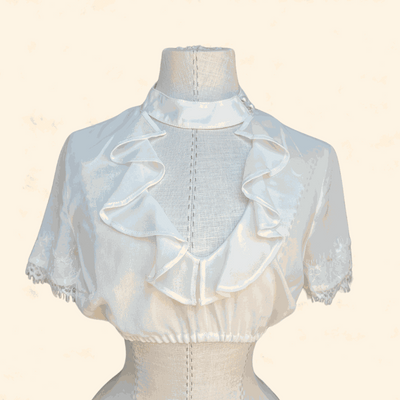Ecru dirndl blouse from Kruger Collection, size 36, made of 100% polyester with ruffled design.